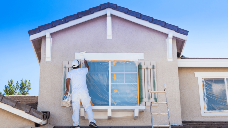 A House Painter Working On A House Www.onemorestarmedia.com