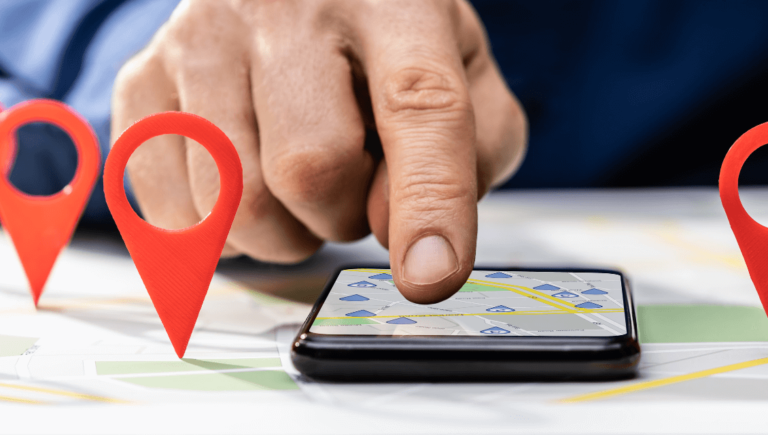 A Hand Touching A Cell Phone Showing Local Search Let'S Chat Www.onemorestarmedia.com
